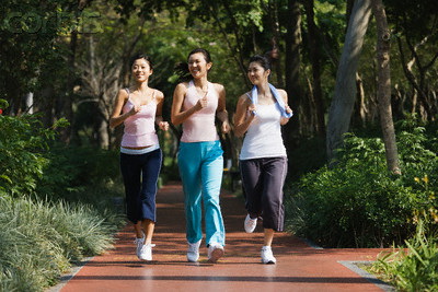 Young Women Power Walking --- Image by © Redlink Production/Corbis